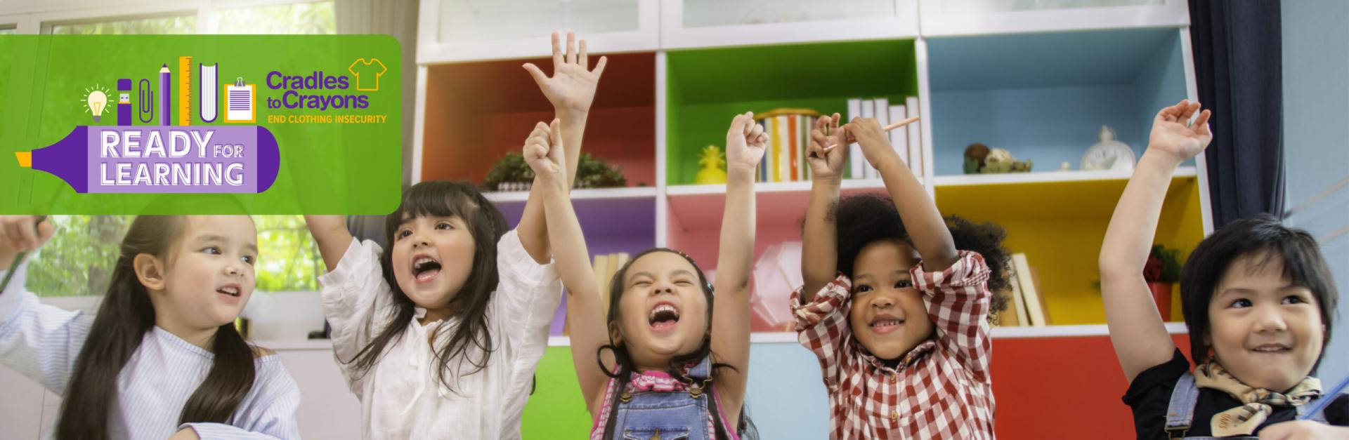 Children with backpacks entering school